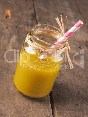 Apple kiwi smoothie on wood