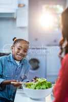 Girl smiling while preparing food