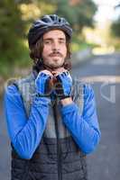 Male biker wearing bicycle helmet