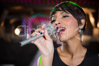 Woman singing in bar