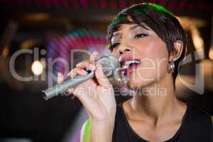 Woman singing in bar