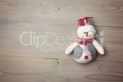 Close-up of snowman on wooden table