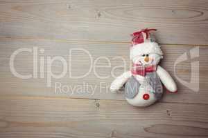 Close-up of snowman on wooden table