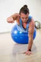 Man exercising on exercise ball