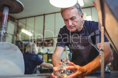 Glassblower working on a glass