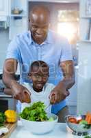 Father and son preparing food