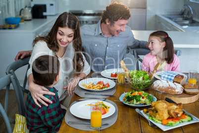 Happy family having breakfast