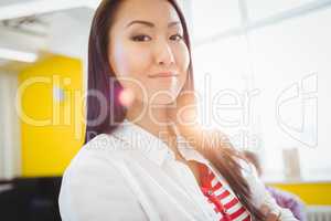 Portrait of confident businesswoman at creative office