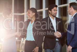 Group of businesspeople shaking hands with each other