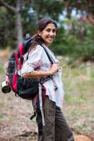 Female hiker standing in forest