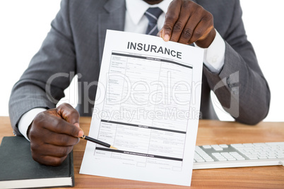 Businessman showing insurance document