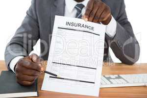 Businessman showing insurance document
