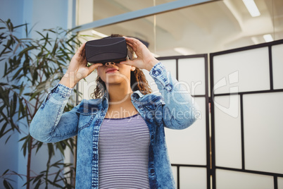 Low angle view of executive enjoying virtual reality headset at creative office