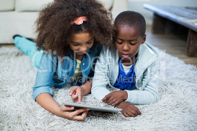 Children using digital tablet