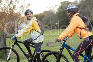 Biker couple interacting while cycling