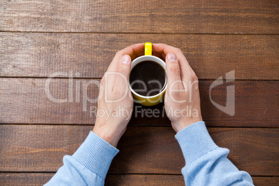 Man holding a cup of coffee