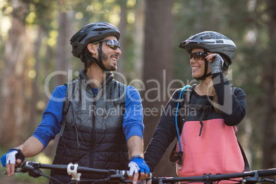 Biker couple smiling and looking at each other