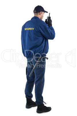 Security officer talking on walkie-talkie