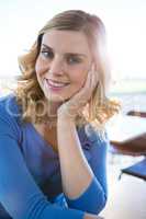 Smiling woman sitting in a coffee shop