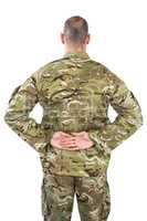 Rear view od soldier standing with his hands behind back