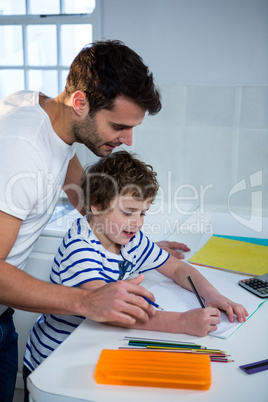 Father helping son with homework