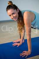 Portrait of smiling woman performing yoga