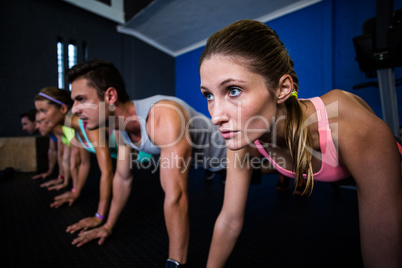 Athletes doing push-ups in gym