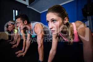 Athletes doing push-ups in gym