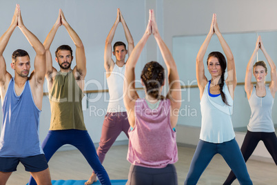 Instructor taking yoga class