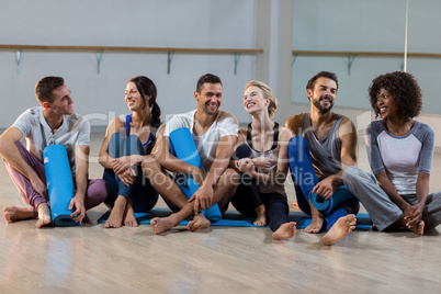 Group of people sitting on floor