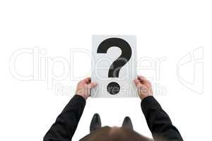 Businessman holding paper with question mark sign