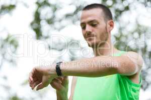 Man adjusting a time on wristwatch