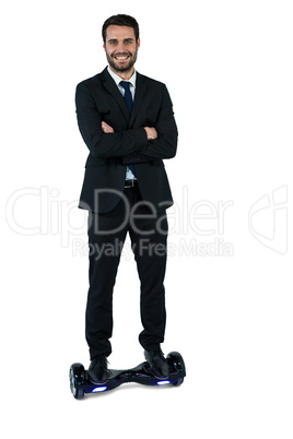 Portrait of businessman on hoverboard