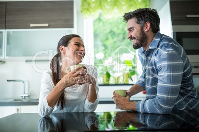 Couple interacting while having coffee