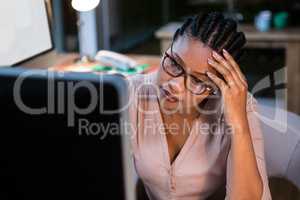 Businesswoman working on computer at her desk