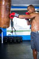 Boxer punching bag in fitness studio