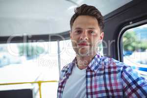 Portrait of man traveling in bus