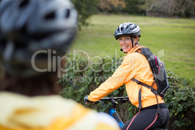 Female biker smiling while cycling