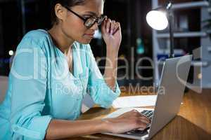 Businesswoman working on laptop