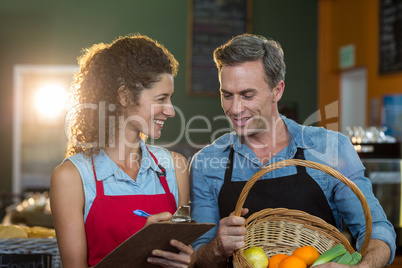 Staff members maintain records on clipboard