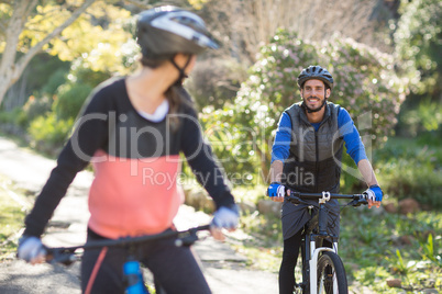 Biker couple cycling in countryside