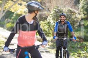 Biker couple cycling in countryside