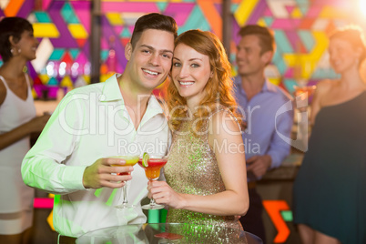 Romantic couple having glass of cocktail