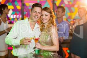 Romantic couple having glass of cocktail