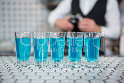 Glass of blue lagoon drinks on bar counter