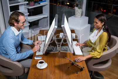 Business executives working on computer