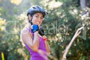 Female athletic wearing bicycle helmet in countryside