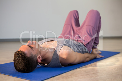 Man in yoga corpse pose