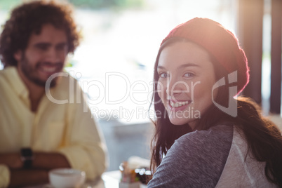 Portrait of smiling woman having cup of coffee