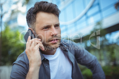 Handsome man talking on mobile phone